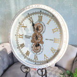 Decorative clock with Roman numerals on a light background motion wall clock metal case moving gears