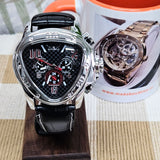 Luxury watch with black strap and detailed face, displayed on a wooden stand with a promotional leaflet in the background.