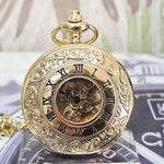 Gold pocket watch with intricate design on a blurred background