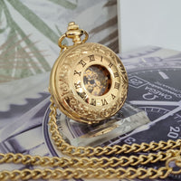 Gold pocket watch with chain on a banknote background