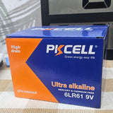 Box of PKCELL ultra alkaline batteries on a surface with a blurred background