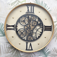 Decorative wall clock with mechanical design on a leaf-patterned background