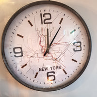 Wall clock with New York subway map design on a light background