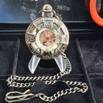 Decorative pocket watch with chain on a black display stand