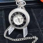 Silver pocket watch with chain on a black background