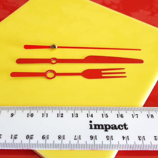 clock hands knife fork red